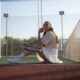 Female tennis player bending over mid shot during match